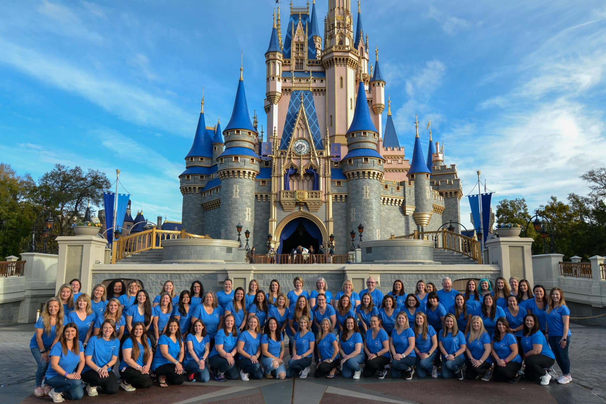 Best Disney Vacation Planners with Fairytale Journeys Travel Advisors in front of Cinderella Castle