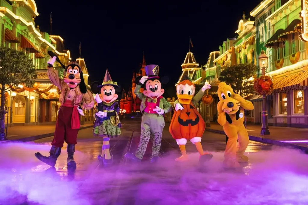Mickey, Minnie, Donald, Goofy and Pluto in Halloween costumes at Magic Kingdom